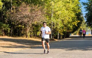 Active adult running on an outdoor trail in the Treasure Valley area
