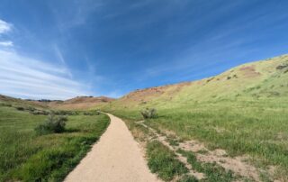 Adult hiker walking on a scenic trail in the Idaho foothills